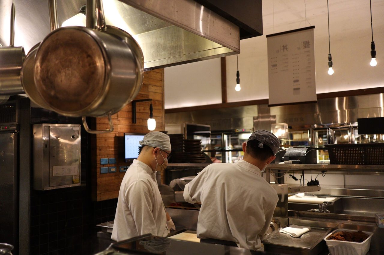 Professional chef cooking in kitchen with culinary preparation techniques